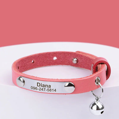 Pink personalized leather pet collar with name, phone number engraving, and small bell